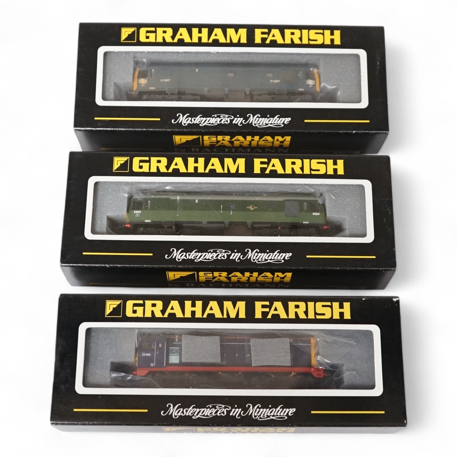 Three boxed Graham Farish N gauge railway diesel locomotives; Class 25, D7667 (371-076), Class 25, D5237 (371-075) and Class 20, 20906 (371-025). Condition - good.
